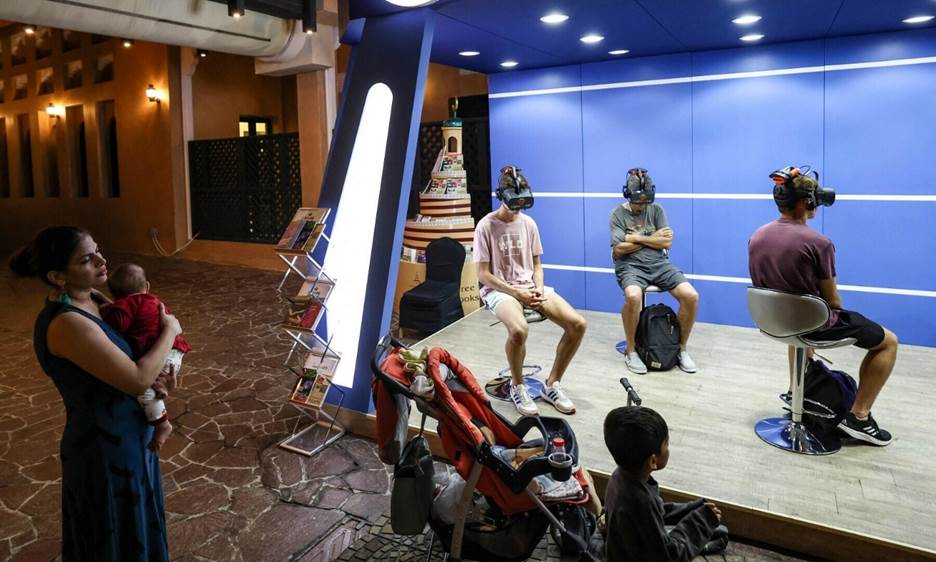 Young football fans watch a five-minute virtual reality tour of Islam, near Doha’s Blue Mosque, during the Qatar 2022 World Cup football tournament, on November 29, 2022. — AFP