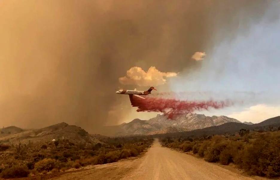 An air tanker making a fire retardant drop over the York fire in Mojave National Preserve on Saturday, July 29, 2023.