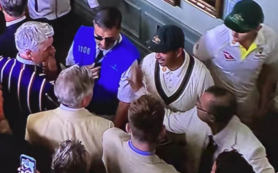 David Warner in the long room talks to some members as Australia go to lunch