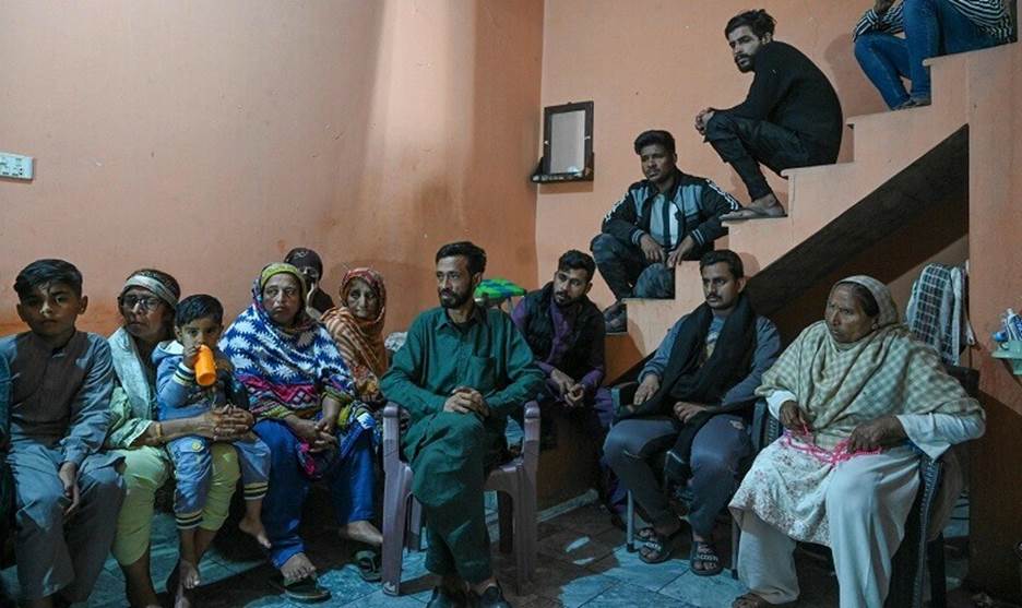  In this picture taken on March 2, 2023, mourners gather at Muhammad Nadeem’s house in Gujrat district of Punjab province, who died in Libya boat capsizing along with other migrants. — AFP 