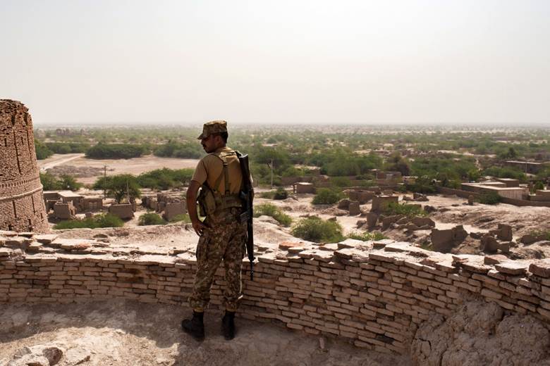 A soldier on the ramparts of Derawar Fort looking out over the Cholistan desert.