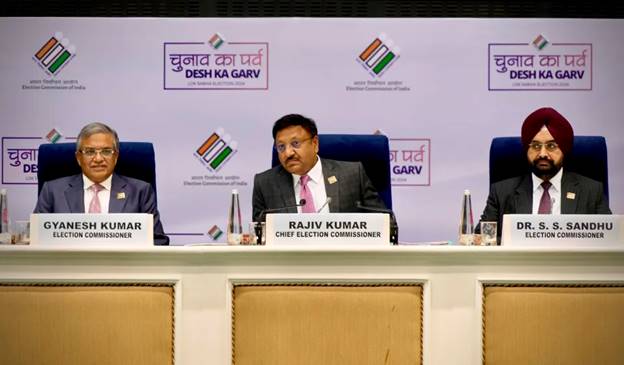 Chief Election Commissioner of India, Rajiv Kumar, center, sits with the election commissioners Gyanesh Kumar, left, and S. S. Sandhu at a press conference organized by the commission to announce dates for the national elections, in New Delhi, India, Saturday, March 16, 2024. (AP Photo/Manish Swarup)