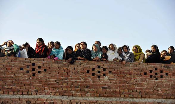 To go with Pakistan-unrest-minorities-religion,FOCUS by Khurram ShahzadThis photograph taken on March 4 shows Pakistani Christian women gathering...