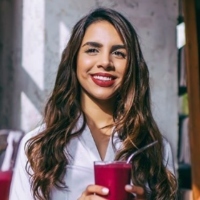 A person holding a cup Description automatically generated with low confidence