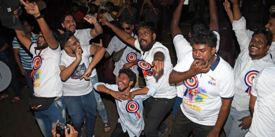 fans of indian film actor rajinikanth cheer and whistle