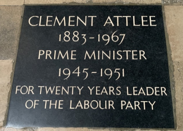 A tombstone with writing on it Description automatically generated with medium confidence