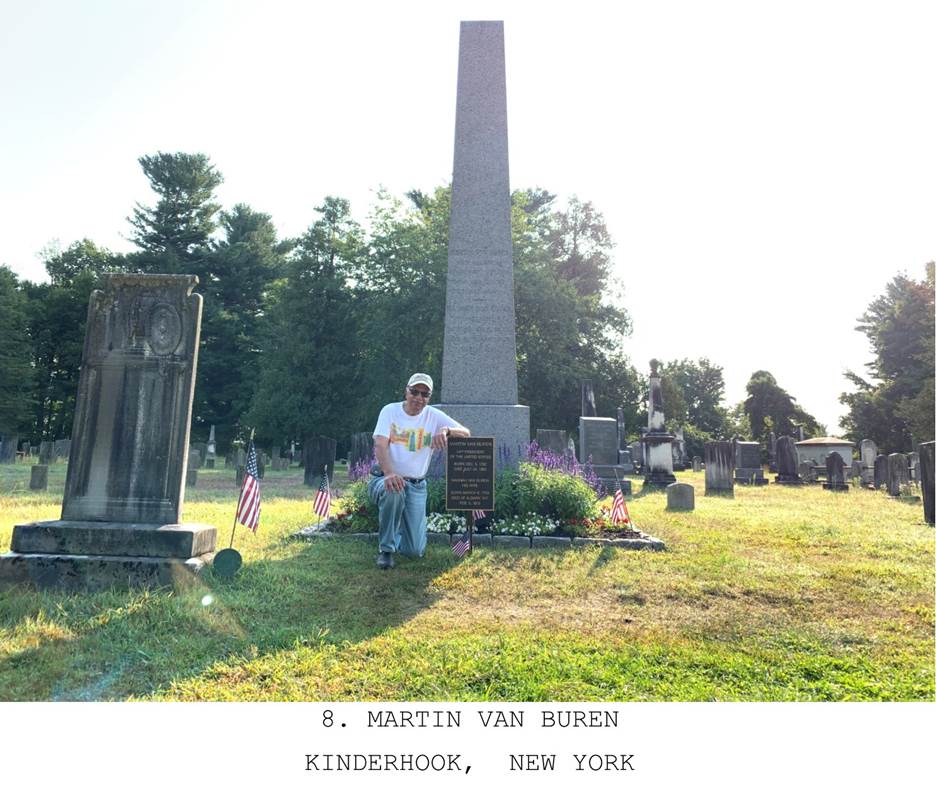 A person standing in a cemetery  Description automatically generated with medium confidence