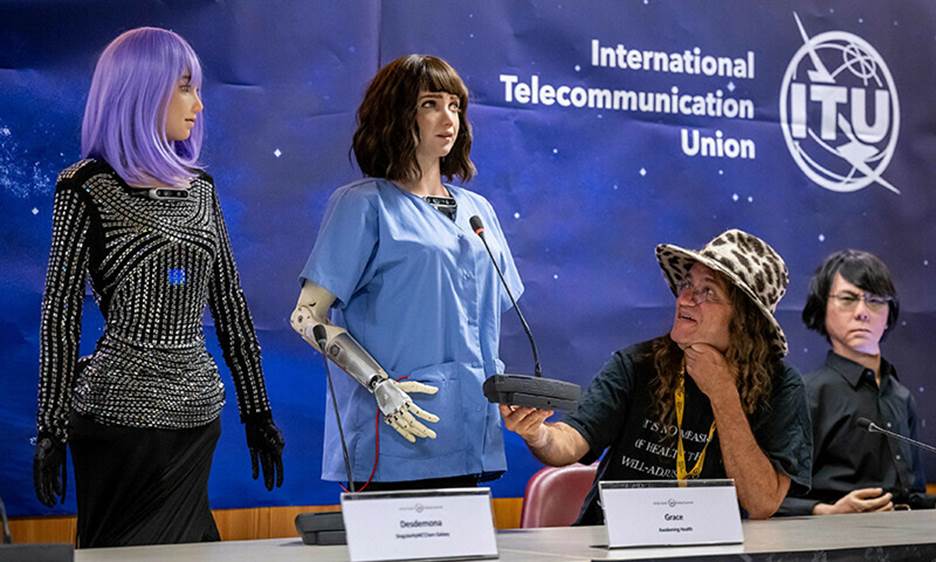 (LEFT to right) AI robot ‘Desdemona’, healthcare robot ‘Grace’, SingularityNET CEO Ben Goertzel and tele-operated android ‘Geminoid HI-2’ attend what was dubbed the world’s first press conference with a panel of AI-enabled robots.—AFP