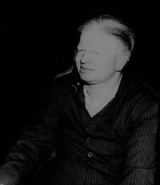 A person in a dark room Description automatically generated