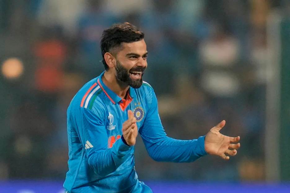 India's Virat Kohli celebrates the dismissal of Netherlands' captain Scott Edwards during the ICC Men's Cricket World Cup match between India and Netherlands in Bengaluru, India, Sunday, Nov. 12, 2023. (AP Photo/Aijaz Rahi)