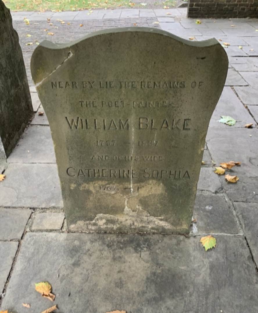 A tombstone with text on it Description automatically generated
