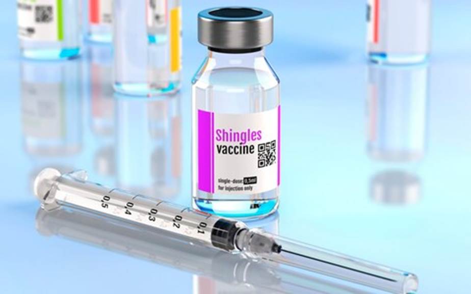 A syringe and vials of liquid Description automatically generated