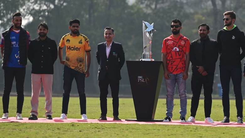 The six captains and PCB chairman Mohsin Naqvi pose with the PSL trophy • AFP/Getty Images