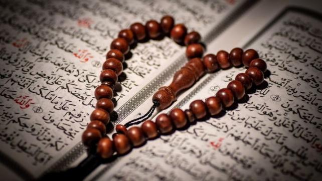 A close up of a rosary Description automatically generated