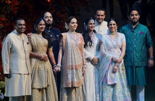 A group of people in traditional dresses Description automatically generated
