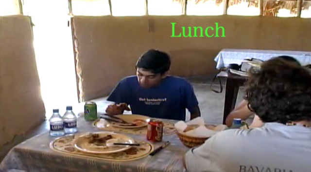 A group of people eating at a table Description automatically generated