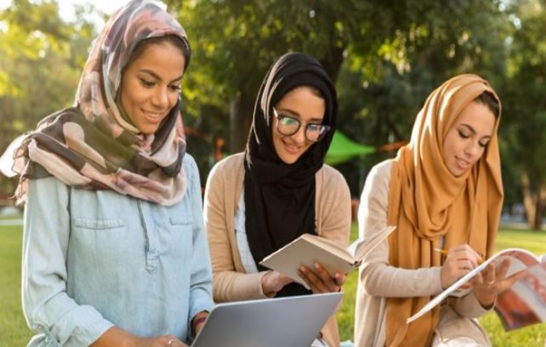 A group of women sitting outside AI-generated content may be incorrect.
