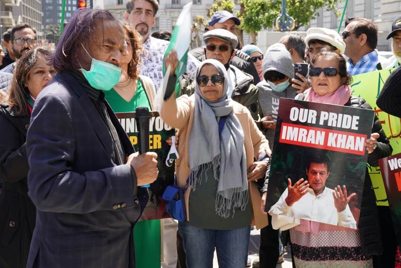 A group of people holding signs Description automatically generated with medium confidence