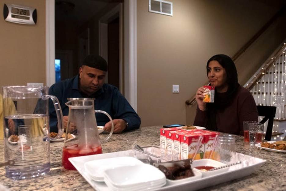 Maha Malik and her dad Abdul Subhan Malik break their fasts with water, dates, appetizers and juice around 7:30 p.m. at their home in Ivyland on Monday, April 4, 2022. Nur B. Adam / Bucks County Courier Times
