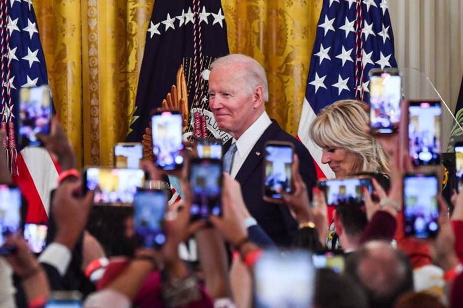 US President Joe Biden and First Lady Jill Biden arrive for an Eid Al Fitr reception in the East Room of the White House in Washington. AFP