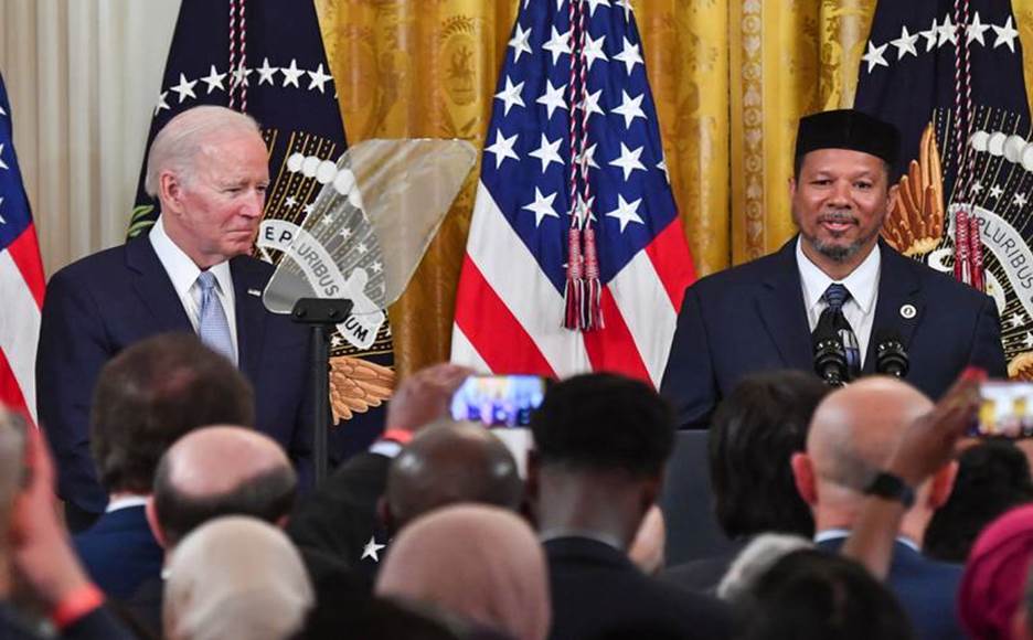 Dr  Talib Shareef speaks alongside US President Joe Biden during an Eid Al Fitr reception in the East Room of the White House. AFP