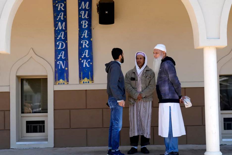 People are shown outside Omar Mosque, in Paterson before afternoon prayers.  During the morning prayer session, Imam Sayed Elnakib (not shown) was stabbed twice and was taken to St. Joseph Regional Medical, where he is in stable condition. The alleged attacker was praying at the mosque before the attack.  Others praying at the mosque apprehended the man before police arrived. Sunday, April 9, 2023 