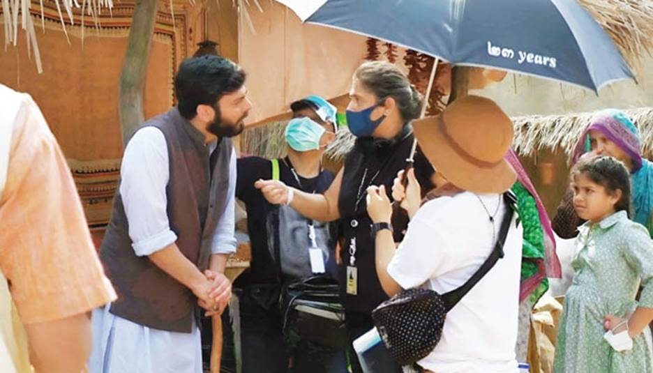 Fawad Khan and Sharmeen Obaid-Chinoy, behind-the-scenes on the Ms. Marvel set, released in 2022.