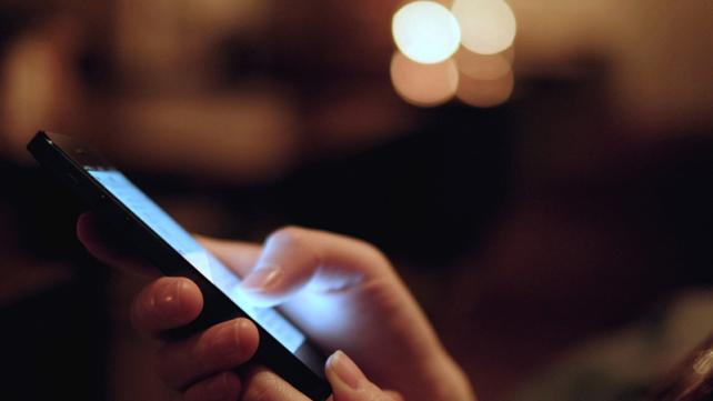 Close-up of a person using a cell phone Description automatically generated with medium confidence