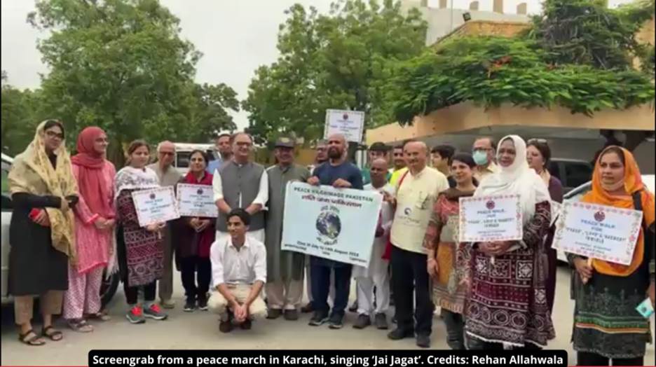 A group of people holding signs Description automatically generated