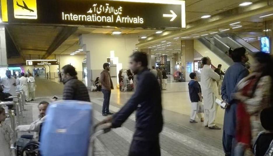 People stands at the Jinnah International Airport in Karachi. — AFP/File