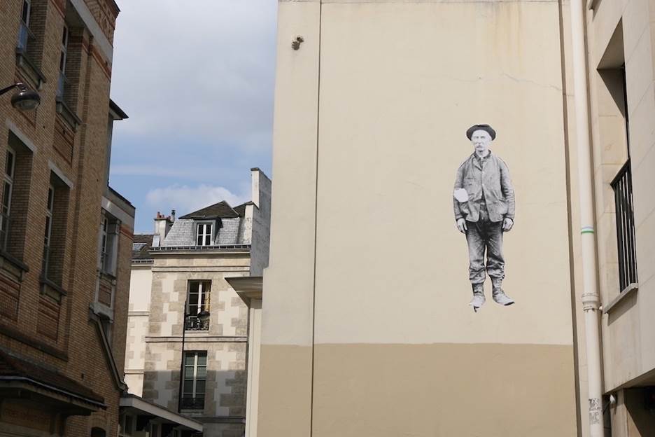 A wall with a drawing of a person on it Description automatically generated with low confidence