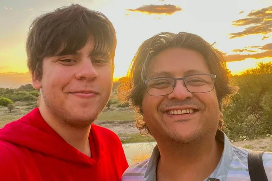 Two men taking a selfie Description automatically generated with medium confidence