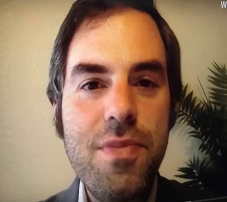 A person with a beard Description automatically generated with low confidence