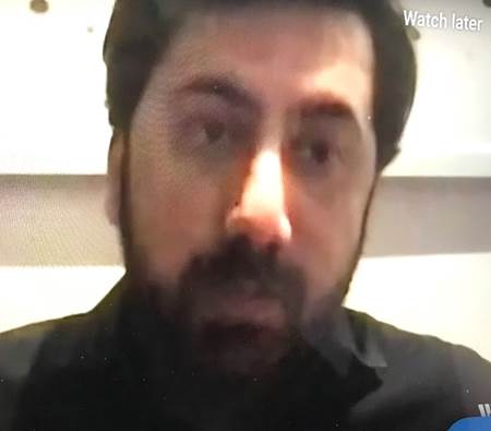 A person with a beard Description automatically generated with low confidence