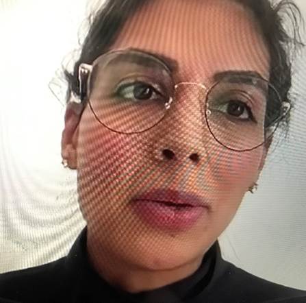 A picture containing person, glasses, indoor, wearing Description automatically generated