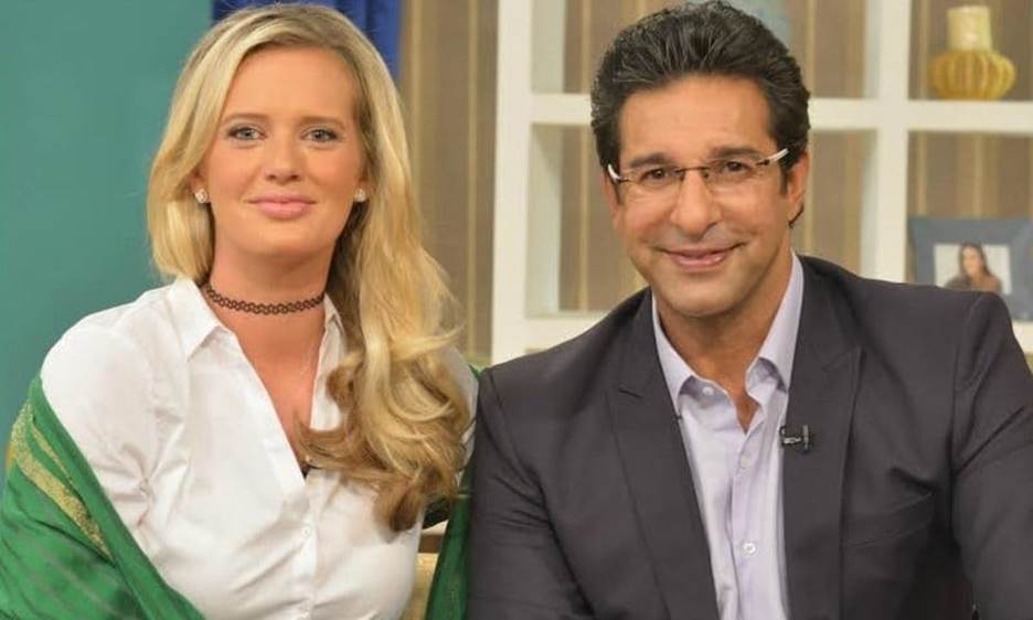 Two people smiling Description automatically generated with medium confidence