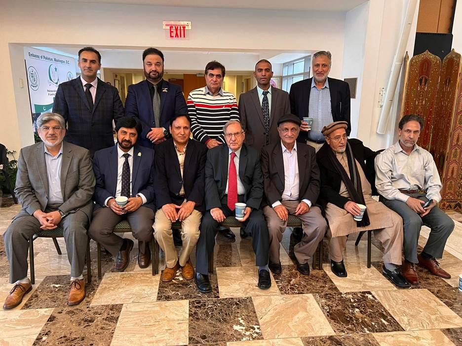 A group of men posing for a photo Description automatically generated
