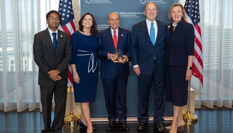 American citizen of Pakistani origin S. Javaid Anwar (centre) poses for a photo with former US president George W. Bush and others at the Presidential Reception of 25th Annual Jesse H. Jones Awards Luncheon. — Supplied