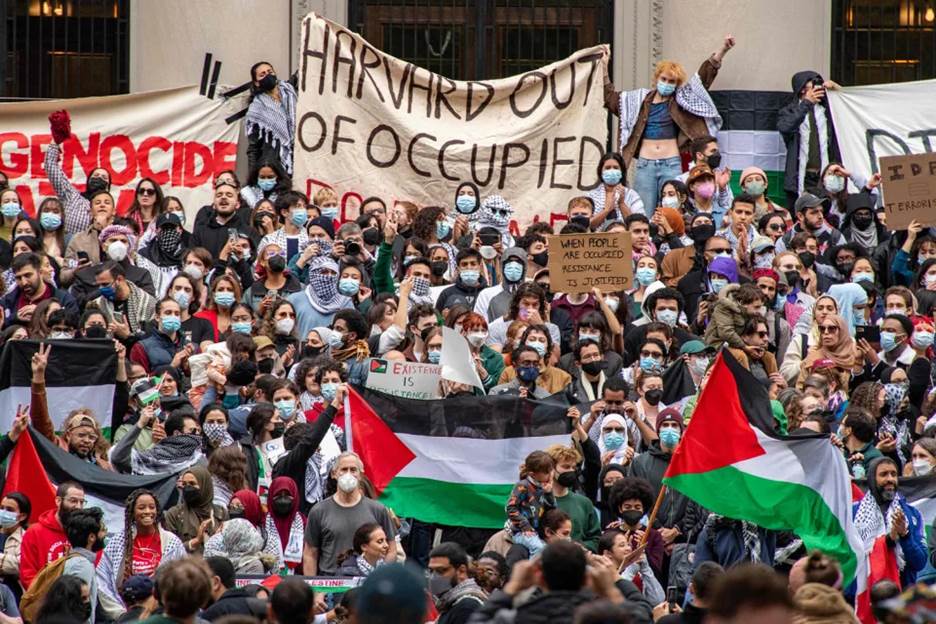 Protesters at Harvard University show their support for Palestinians in Gaza at a rally in Cambridge, Mass., on Oct. 14, 2023.  (Joseph Presiozo / AFP - Getty Images)