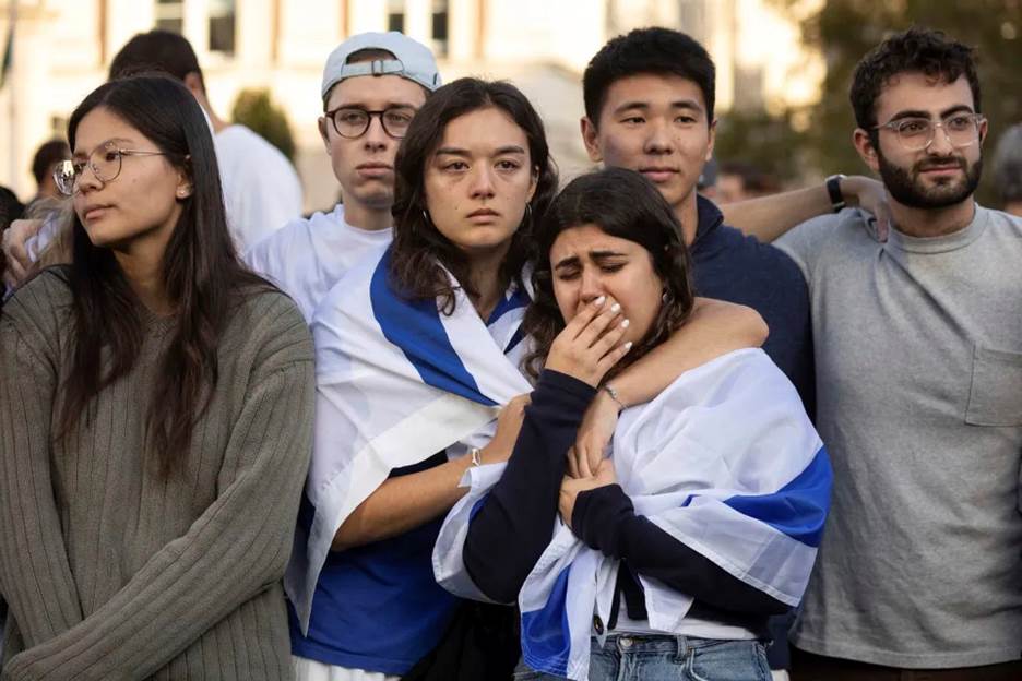 Pro-Israel demonstrators react while singing a song during a protest at Columbia University on Oct. 12, 2023, in New York. (Yuki Iwamura / AP)
