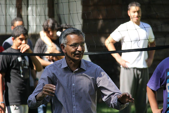 A person standing in front of a net Description automatically generated