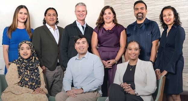 A group of people posing for a photo Description automatically generated