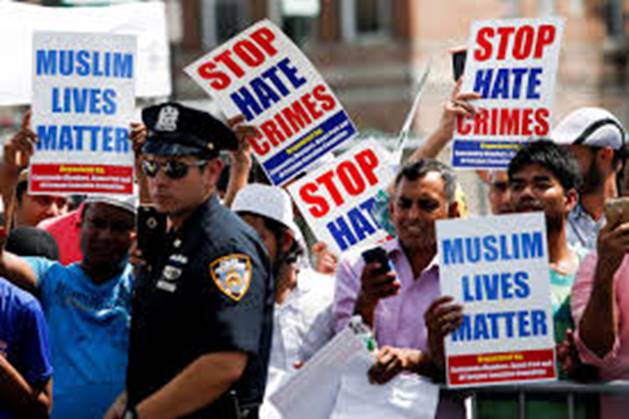 A group of people protesting Description automatically generated