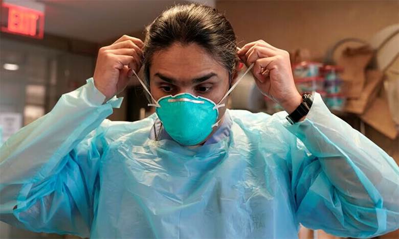 Dr Syed Naqvi, a pulmonologist, dons an N95 mask before entering the ICU at SSM Health St Anthony Hospital amid the outbreak of the coronavirus disease  in Oklahoma City, Oklahoma, US, January 28, 2021. — Reuters/File