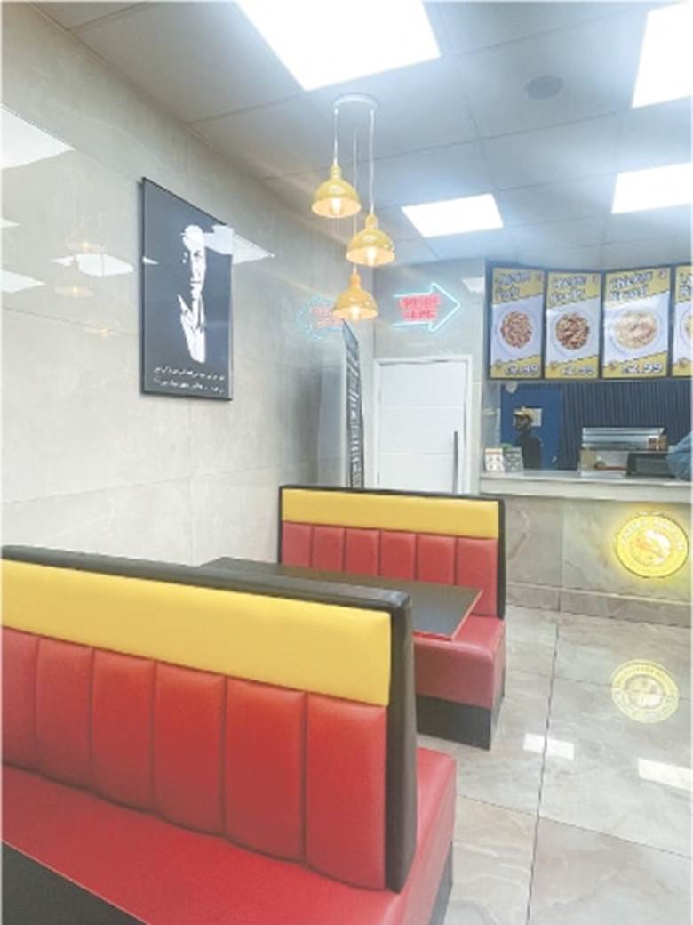 A picture of ex-PM Imran Khan hangs on a wall at Laziza Biryani in London’s Ilford Lane.—Photo by the writer