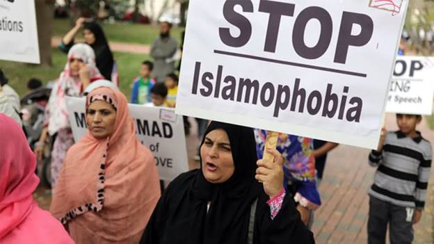 A group of women protesting  Description automatically generated