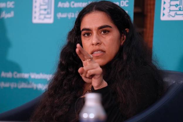 A person pointing her finger Description automatically generated