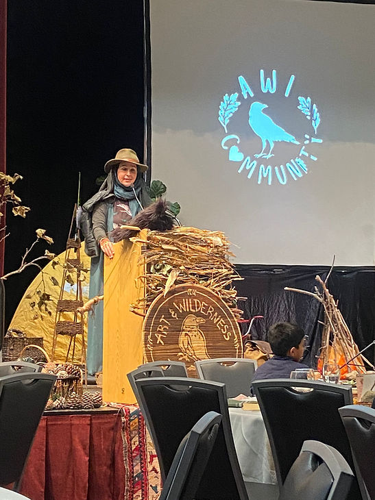 A person standing on a stage Description automatically generated