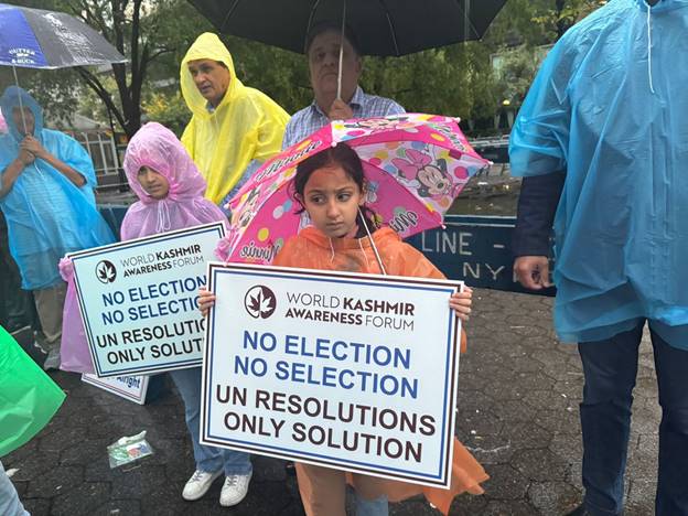 A group of people holding signs Description automatically generated