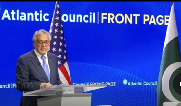 A person standing at a podium with a flag behind him AI-generated content may be incorrect.
